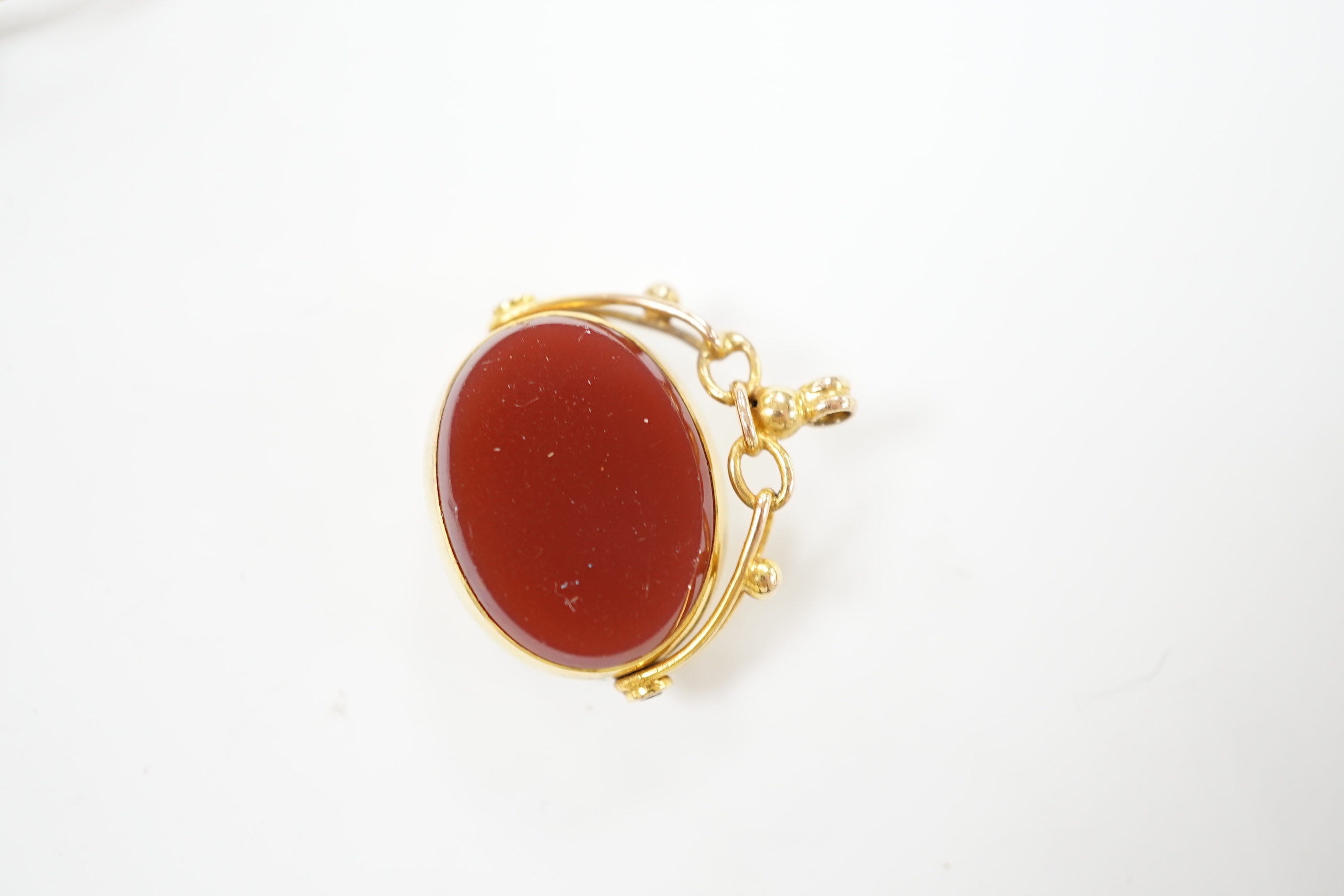 A George V 9ct gold mounted carnelian and bloodstone set spinning fob, width 21mm, together with a pair of gold plated lorgnettes.